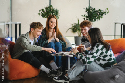 Four students handing out in the student lounge